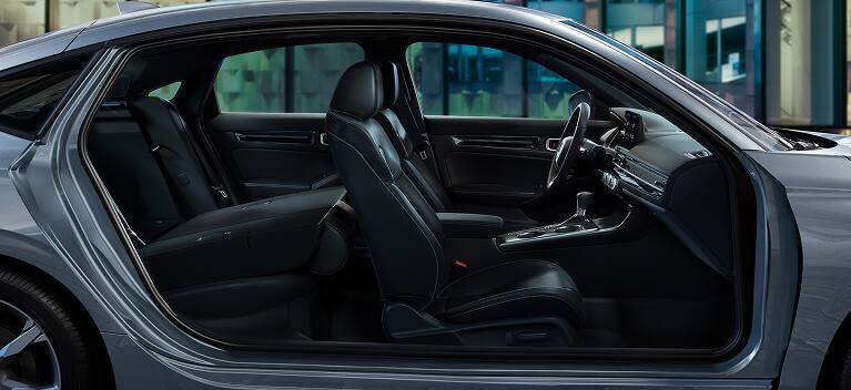 2026 Honda Civic Hatchback Touring Hybrid leather-trimmed seats with rear seat folded down (Compact Hatchback).